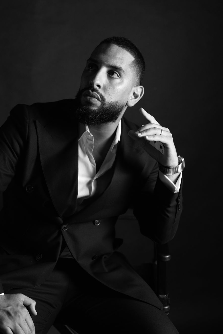 First magician and mentalist of the duo, portrait in a black suit